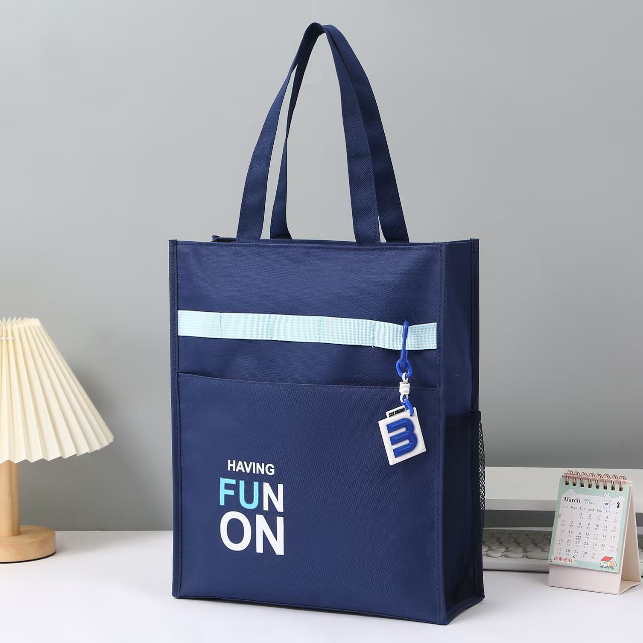 Product photo of a navy tote bag before editing